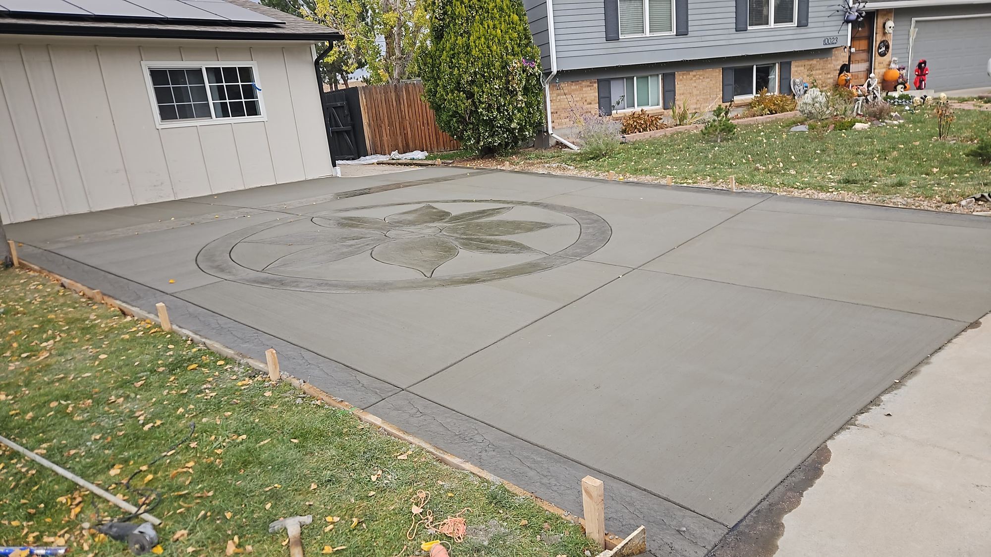 New driveway with a stamped compass medallion