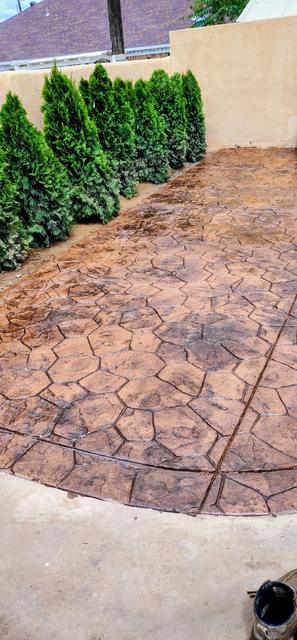 Stamped patio along a garden wall