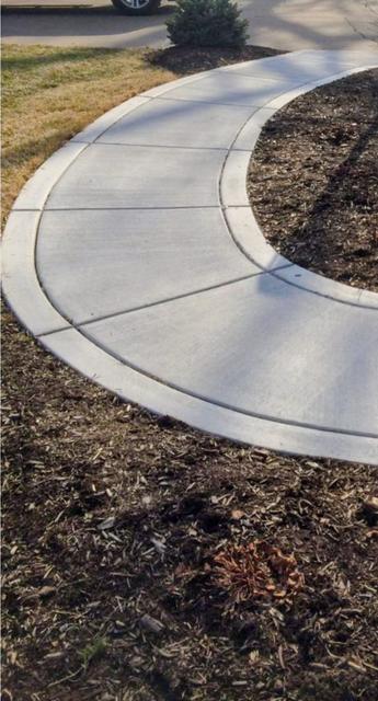 Curved walkway around a planting bed